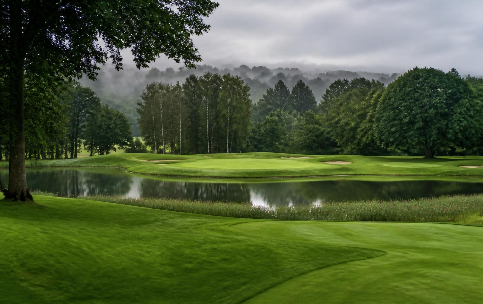 English parkland course with a lake guarding the green